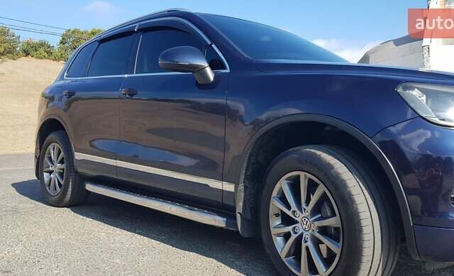 Синий Фольксваген Туарег, объемом двигателя 2.97 л и пробегом 325 тыс. км за 21500 $, фото 23 на Automoto.ua