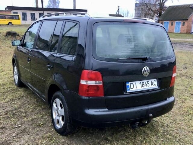 Черный Фольксваген Туран, объемом двигателя 2 л и пробегом 400 тыс. км за 4999 $, фото 7 на Automoto.ua