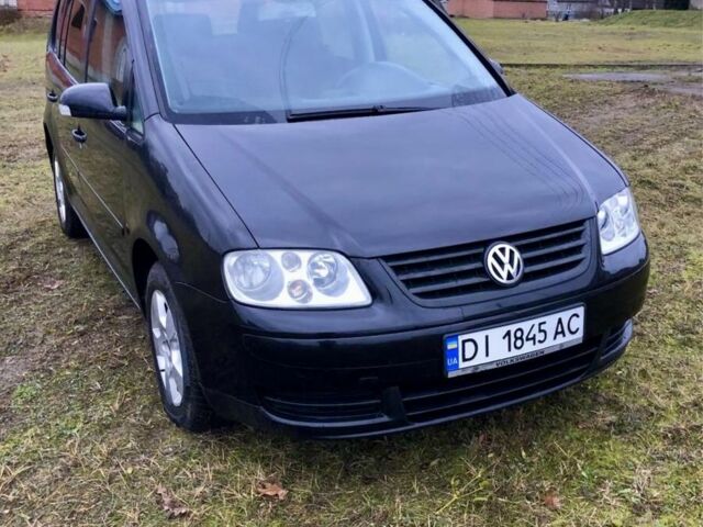 Черный Фольксваген Туран, объемом двигателя 2 л и пробегом 400 тыс. км за 4999 $, фото 1 на Automoto.ua