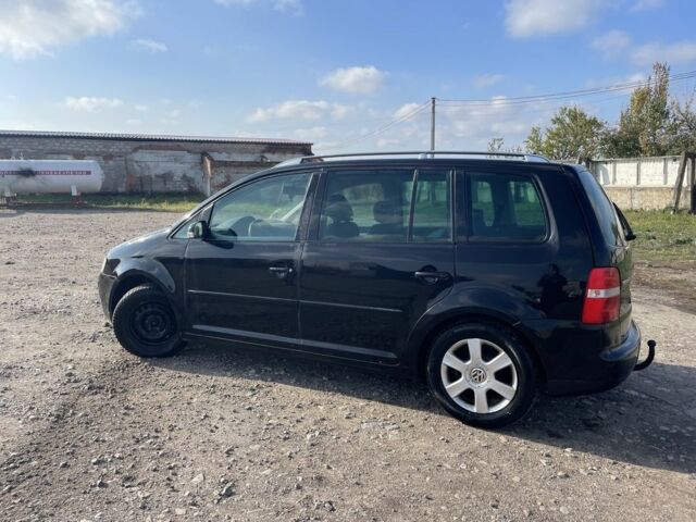 Черный Фольксваген Туран, объемом двигателя 2 л и пробегом 250 тыс. км за 2500 $, фото 1 на Automoto.ua