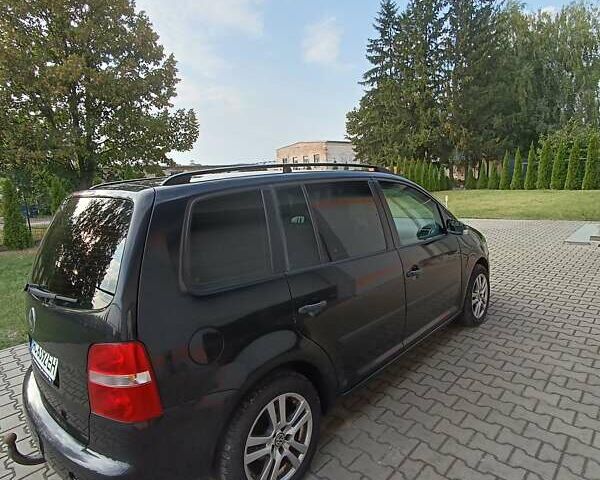 Черный Фольксваген Туран, объемом двигателя 1.6 л и пробегом 222 тыс. км за 5500 $, фото 6 на Automoto.ua