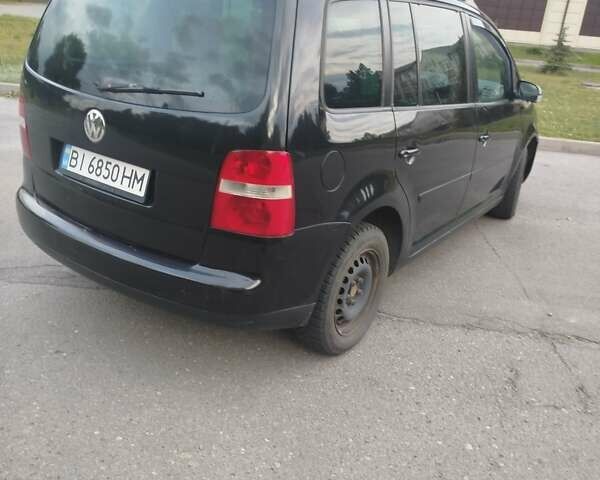 Чорний Фольксваген Туран, об'ємом двигуна 2 л та пробігом 350 тис. км за 5500 $, фото 1 на Automoto.ua