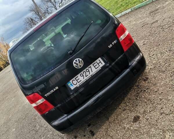 Черный Фольксваген Туран, объемом двигателя 1.6 л и пробегом 218 тыс. км за 5600 $, фото 5 на Automoto.ua