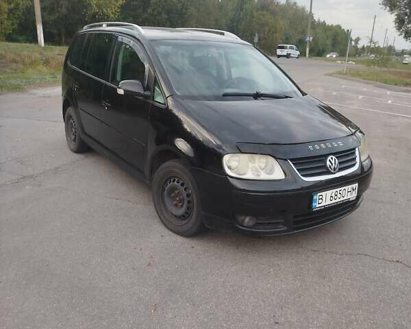 Чорний Фольксваген Туран, об'ємом двигуна 2 л та пробігом 350 тис. км за 5500 $, фото 2 на Automoto.ua