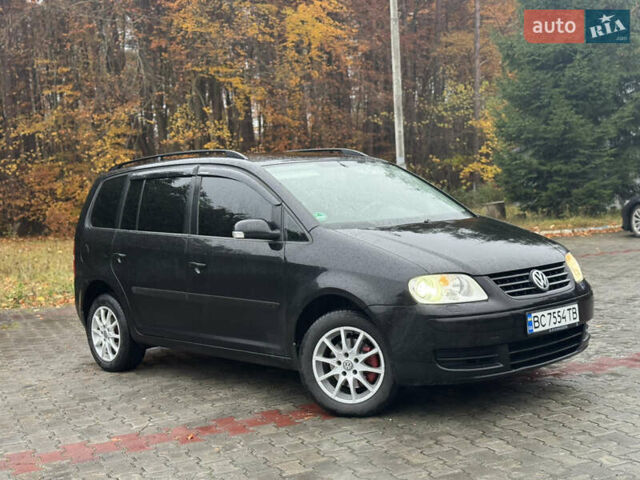 Черный Фольксваген Туран, объемом двигателя 1.6 л и пробегом 255 тыс. км за 5200 $, фото 3 на Automoto.ua