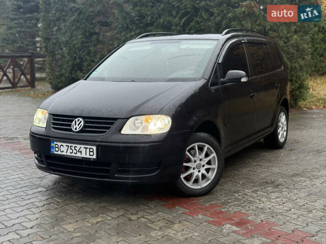 Черный Фольксваген Туран, объемом двигателя 1.6 л и пробегом 255 тыс. км за 5200 $, фото 1 на Automoto.ua