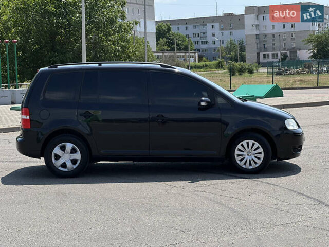 Чорний Фольксваген Туран, об'ємом двигуна 1.6 л та пробігом 249 тис. км за 5799 $, фото 2 на Automoto.ua