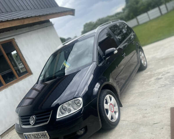 Черный Фольксваген Туран, объемом двигателя 1.6 л и пробегом 218 тыс. км за 5900 $, фото 2 на Automoto.ua