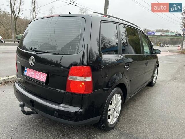 Черный Фольксваген Туран, объемом двигателя 1.6 л и пробегом 192 тыс. км за 5700 $, фото 5 на Automoto.ua