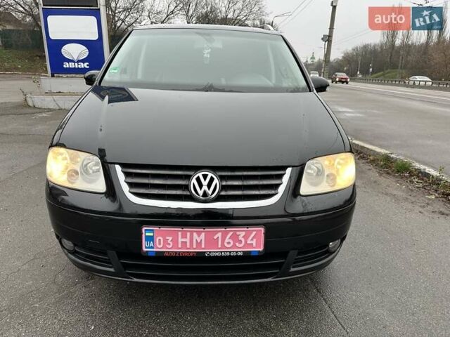 Черный Фольксваген Туран, объемом двигателя 1.6 л и пробегом 192 тыс. км за 5700 $, фото 1 на Automoto.ua