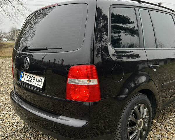 Черный Фольксваген Туран, объемом двигателя 1.6 л и пробегом 208 тыс. км за 5700 $, фото 11 на Automoto.ua