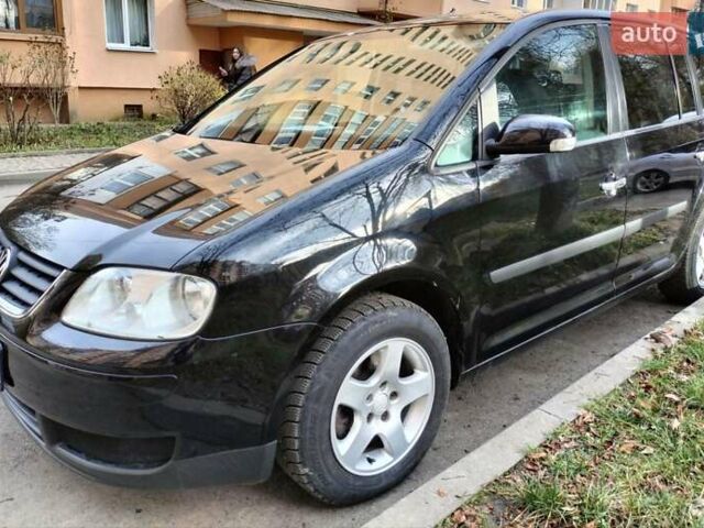 Черный Фольксваген Туран, объемом двигателя 1.6 л и пробегом 202 тыс. км за 5300 $, фото 5 на Automoto.ua