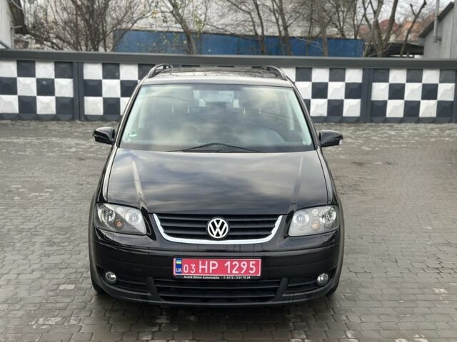 Черный Фольксваген Туран, объемом двигателя 1.6 л и пробегом 206 тыс. км за 5350 $, фото 1 на Automoto.ua