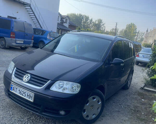 Черный Фольксваген Туран, объемом двигателя 1.6 л и пробегом 218 тыс. км за 5900 $, фото 5 на Automoto.ua