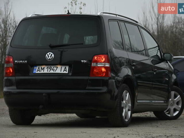 Чорний Фольксваген Туран, об'ємом двигуна 2 л та пробігом 267 тис. км за 5999 $, фото 12 на Automoto.ua