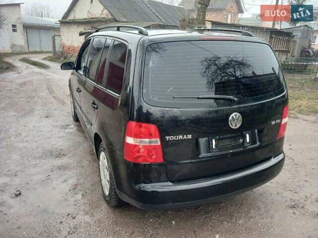 Черный Фольксваген Туран, объемом двигателя 1.6 л и пробегом 201 тыс. км за 4799 $, фото 7 на Automoto.ua
