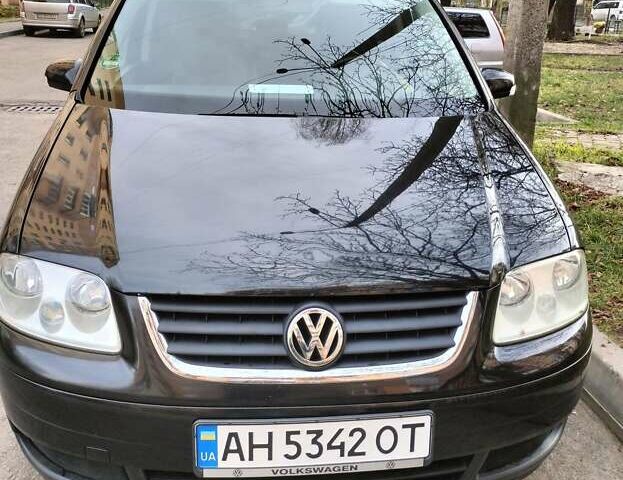 Черный Фольксваген Туран, объемом двигателя 1.6 л и пробегом 202 тыс. км за 5300 $, фото 2 на Automoto.ua