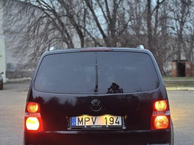 Черный Фольксваген Туран, объемом двигателя 2 л и пробегом 420 тыс. км за 3400 $, фото 4 на Automoto.ua