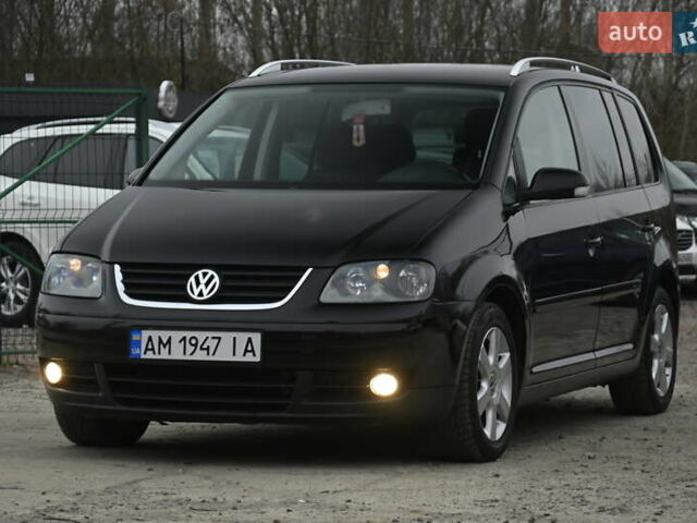 Чорний Фольксваген Туран, об'ємом двигуна 2 л та пробігом 267 тис. км за 5999 $, фото 4 на Automoto.ua