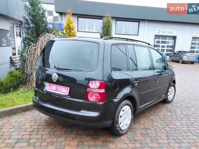 Черный Фольксваген Туран, объемом двигателя 1.6 л и пробегом 237 тыс. км за 5200 $, фото 2 на Automoto.ua