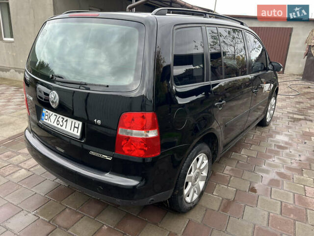 Черный Фольксваген Туран, объемом двигателя 1.6 л и пробегом 271 тыс. км за 5500 $, фото 8 на Automoto.ua
