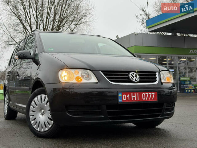 Черный Фольксваген Туран, объемом двигателя 1.6 л и пробегом 214 тыс. км за 5999 $, фото 8 на Automoto.ua