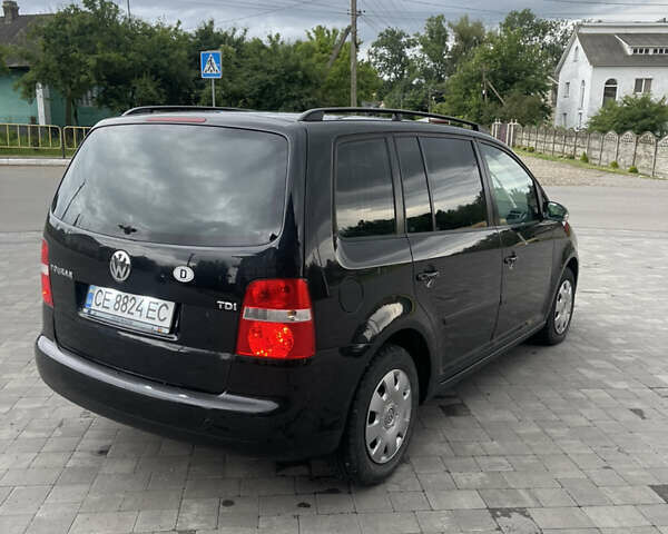 Черный Фольксваген Туран, объемом двигателя 1.9 л и пробегом 284 тыс. км за 6500 $, фото 3 на Automoto.ua