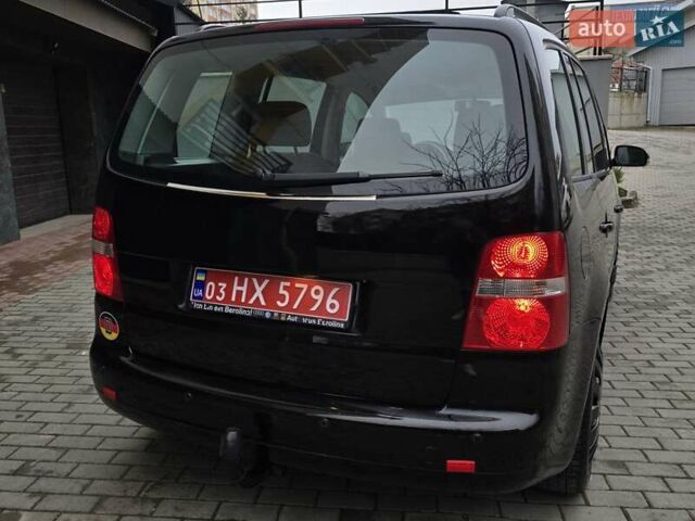 Черный Фольксваген Туран, объемом двигателя 1.6 л и пробегом 219 тыс. км за 5399 $, фото 8 на Automoto.ua