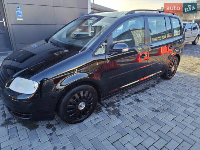 Черный Фольксваген Туран, объемом двигателя 1.6 л и пробегом 219 тыс. км за 5850 $, фото 6 на Automoto.ua