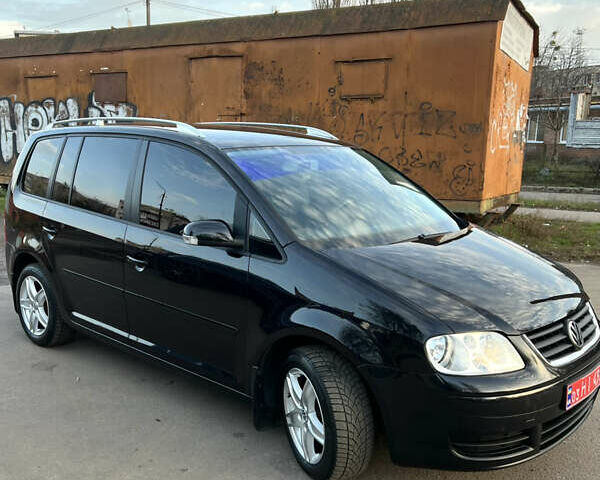 Черный Фольксваген Туран, объемом двигателя 1.6 л и пробегом 229 тыс. км за 6450 $, фото 6 на Automoto.ua