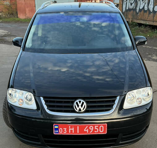 Черный Фольксваген Туран, объемом двигателя 1.6 л и пробегом 229 тыс. км за 6450 $, фото 3 на Automoto.ua