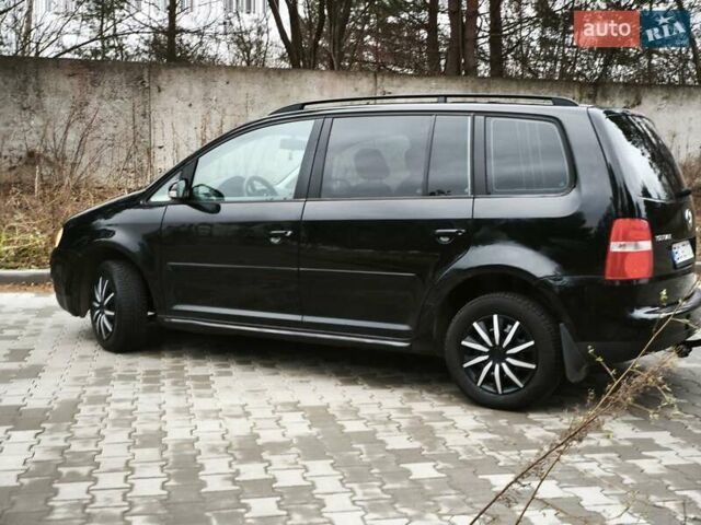 Черный Фольксваген Туран, объемом двигателя 2 л и пробегом 321 тыс. км за 5500 $, фото 6 на Automoto.ua