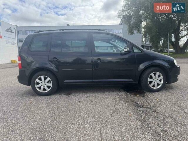 Фольксваген Туран 2005 в Житомире на Automoto.ua Черный Фольксваген Туран, объемом двигателя 1.6 л и пробегом 186 тыс. км за 6950 $, фото 1 на Automoto.ua