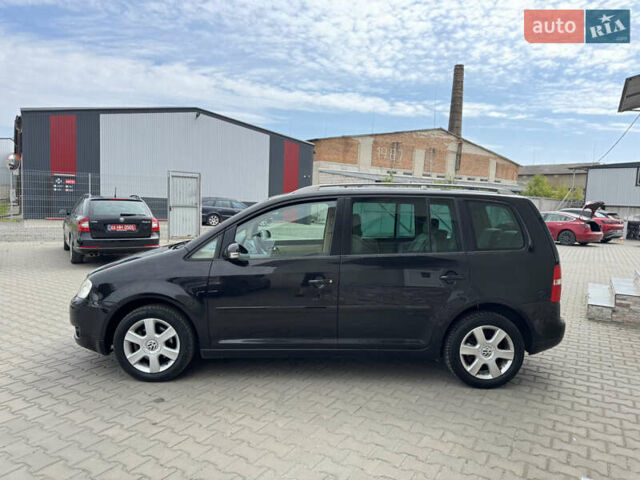 Черный Фольксваген Туран, объемом двигателя 1.98 л и пробегом 188 тыс. км за 4600 $, фото 6 на Automoto.ua