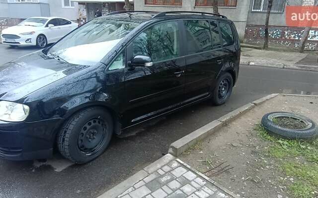 Черный Фольксваген Туран, объемом двигателя 1.97 л и пробегом 243 тыс. км за 6400 $, фото 6 на Automoto.ua