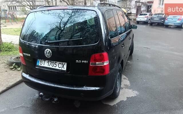 Черный Фольксваген Туран, объемом двигателя 1.97 л и пробегом 243 тыс. км за 6400 $, фото 8 на Automoto.ua