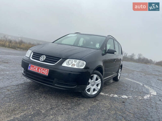 Черный Фольксваген Туран, объемом двигателя 1.6 л и пробегом 198 тыс. км за 6800 $, фото 1 на Automoto.ua