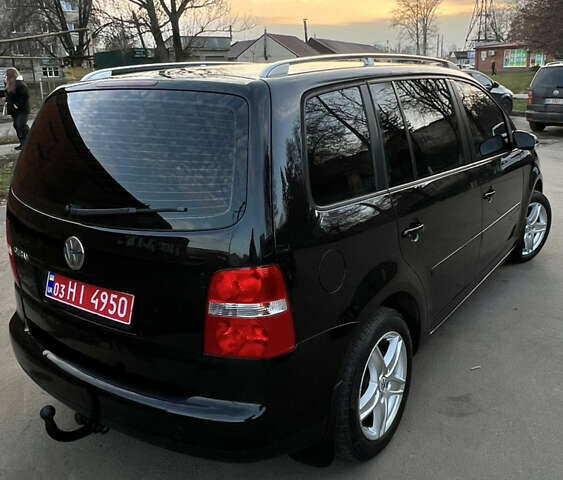 Черный Фольксваген Туран, объемом двигателя 1.6 л и пробегом 229 тыс. км за 6450 $, фото 9 на Automoto.ua