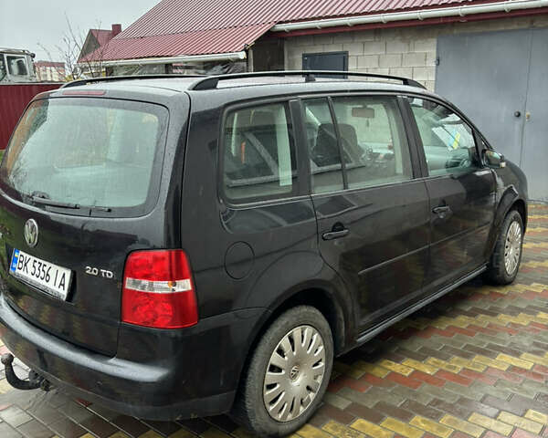 Черный Фольксваген Туран, объемом двигателя 1.97 л и пробегом 316 тыс. км за 5700 $, фото 3 на Automoto.ua
