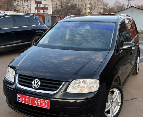 Черный Фольксваген Туран, объемом двигателя 1.6 л и пробегом 229 тыс. км за 6450 $, фото 2 на Automoto.ua
