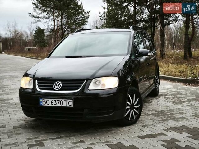 Черный Фольксваген Туран, объемом двигателя 2 л и пробегом 321 тыс. км за 5500 $, фото 2 на Automoto.ua