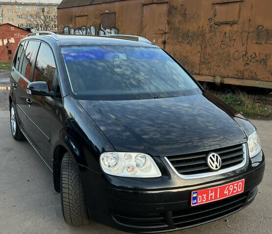 Черный Фольксваген Туран, объемом двигателя 1.6 л и пробегом 229 тыс. км за 6450 $, фото 5 на Automoto.ua