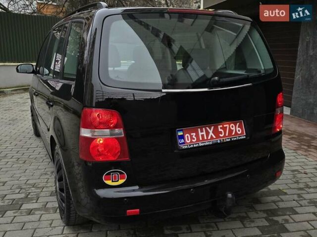 Черный Фольксваген Туран, объемом двигателя 1.6 л и пробегом 219 тыс. км за 5399 $, фото 6 на Automoto.ua