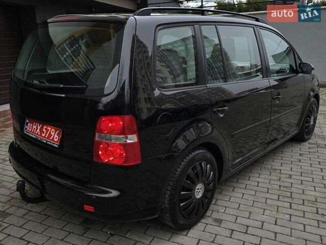 Черный Фольксваген Туран, объемом двигателя 1.6 л и пробегом 219 тыс. км за 5399 $, фото 9 на Automoto.ua