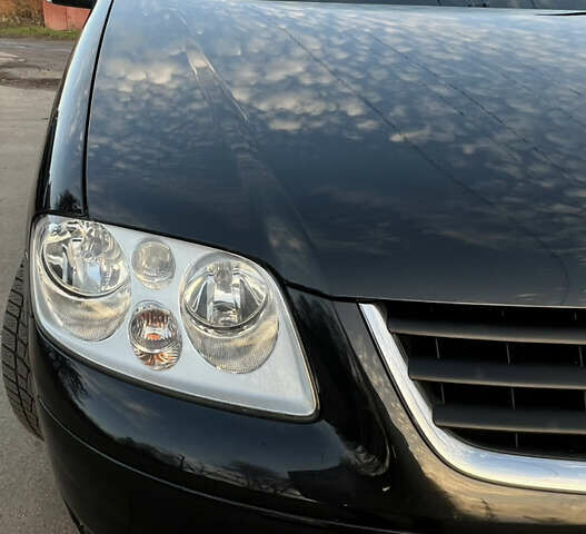 Черный Фольксваген Туран, объемом двигателя 1.6 л и пробегом 229 тыс. км за 6450 $, фото 22 на Automoto.ua