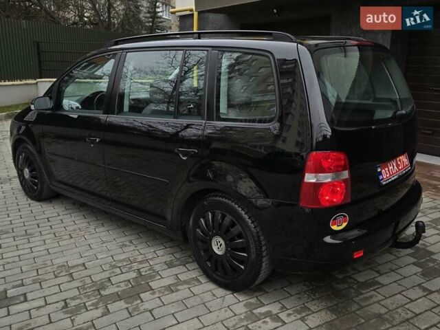 Черный Фольксваген Туран, объемом двигателя 1.6 л и пробегом 219 тыс. км за 5399 $, фото 5 на Automoto.ua