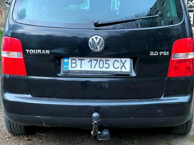 Чорний Фольксваген Туран, об'ємом двигуна 2 л та пробігом 243 тис. км за 6500 $, фото 1 на Automoto.ua