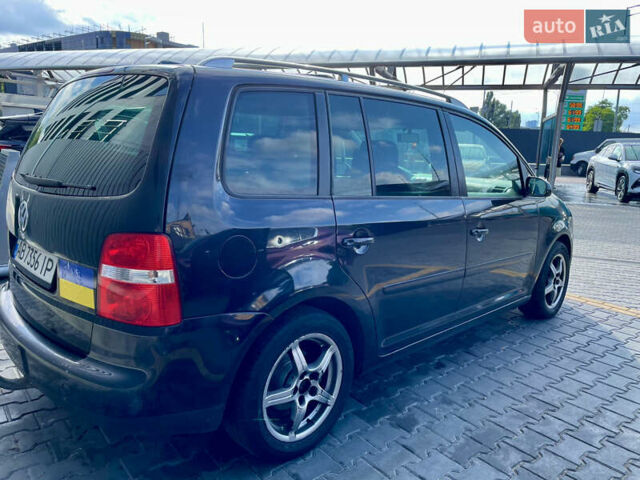 Черный Фольксваген Туран, объемом двигателя 2 л и пробегом 368 тыс. км за 6200 $, фото 1 на Automoto.ua
