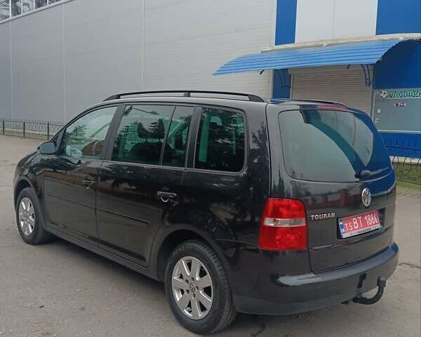 Черный Фольксваген Туран, объемом двигателя 1.6 л и пробегом 204 тыс. км за 6350 $, фото 12 на Automoto.ua