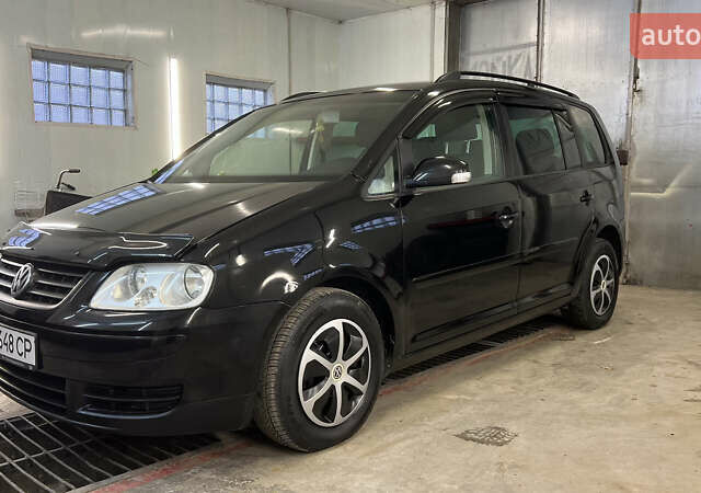 Черный Фольксваген Туран, объемом двигателя 1.9 л и пробегом 419 тыс. км за 5900 $, фото 2 на Automoto.ua